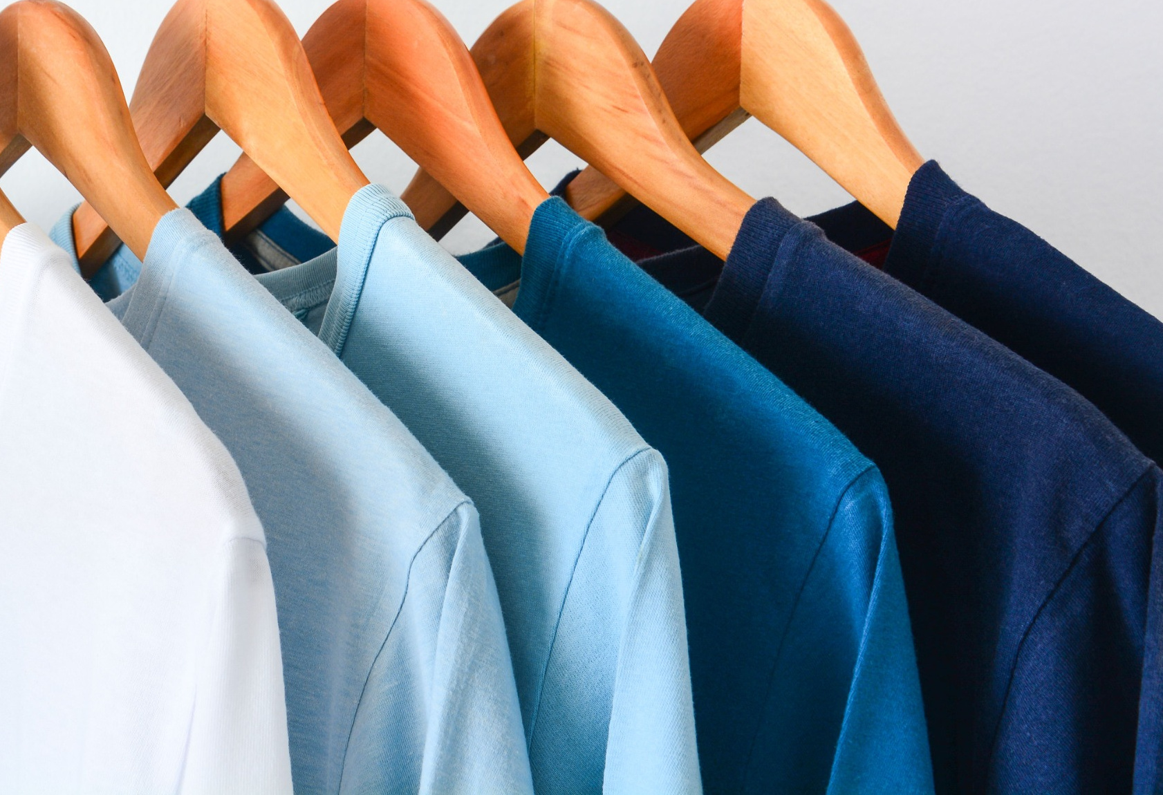 blue shirts on hanger cropped