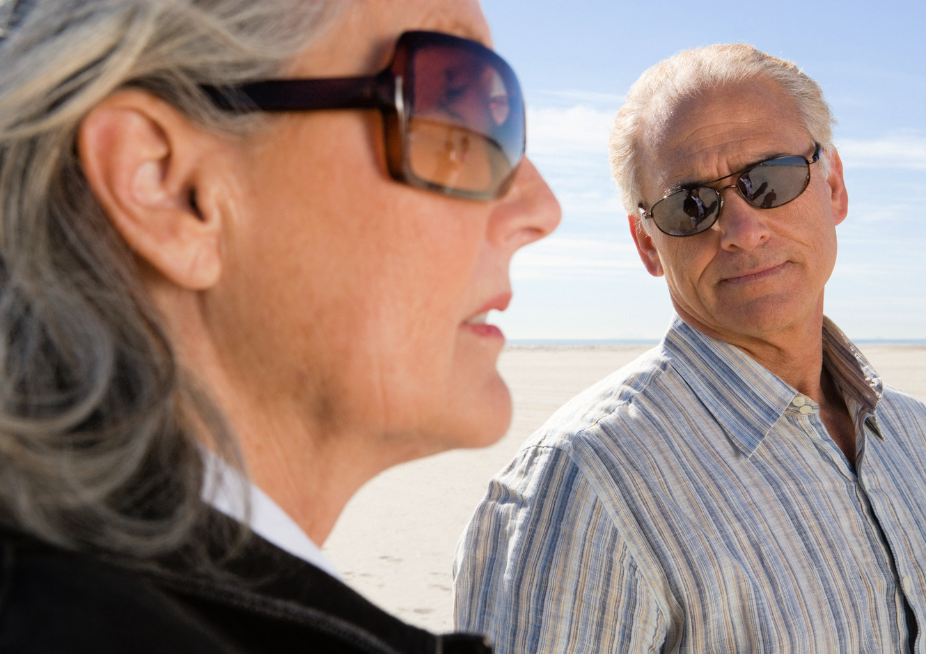 senior woman wearing wrap around sunglasses